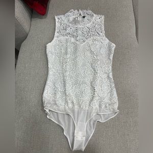Size medium white lace body suit from Sakura